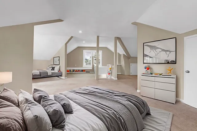 a bed room with a bed and a painting