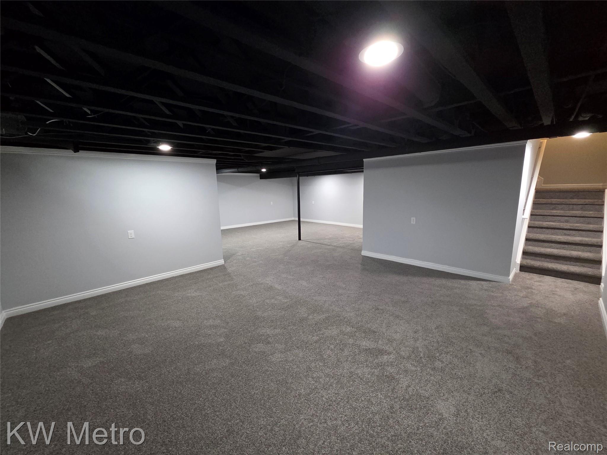 6680 Ridgefield Circle, Unit 104 West Bloomfield, MI 48322 - Photo 19 of 20 FINISHED BASEMENT VIEW ONE