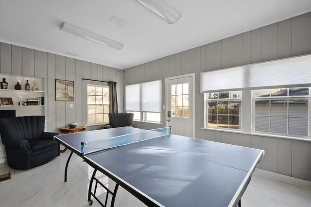 a view of a livingroom with furniture window and wooden floor