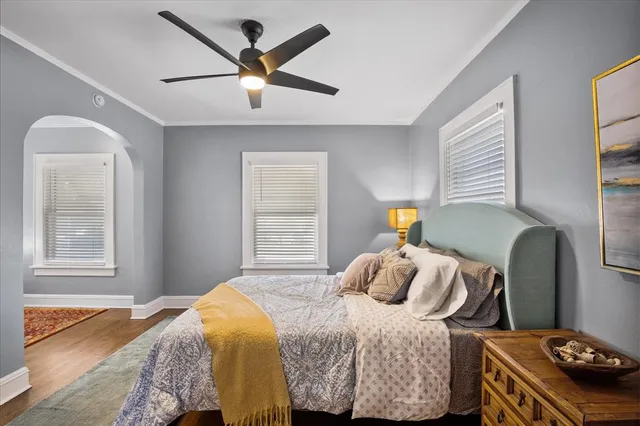 a bedroom with a bed and window