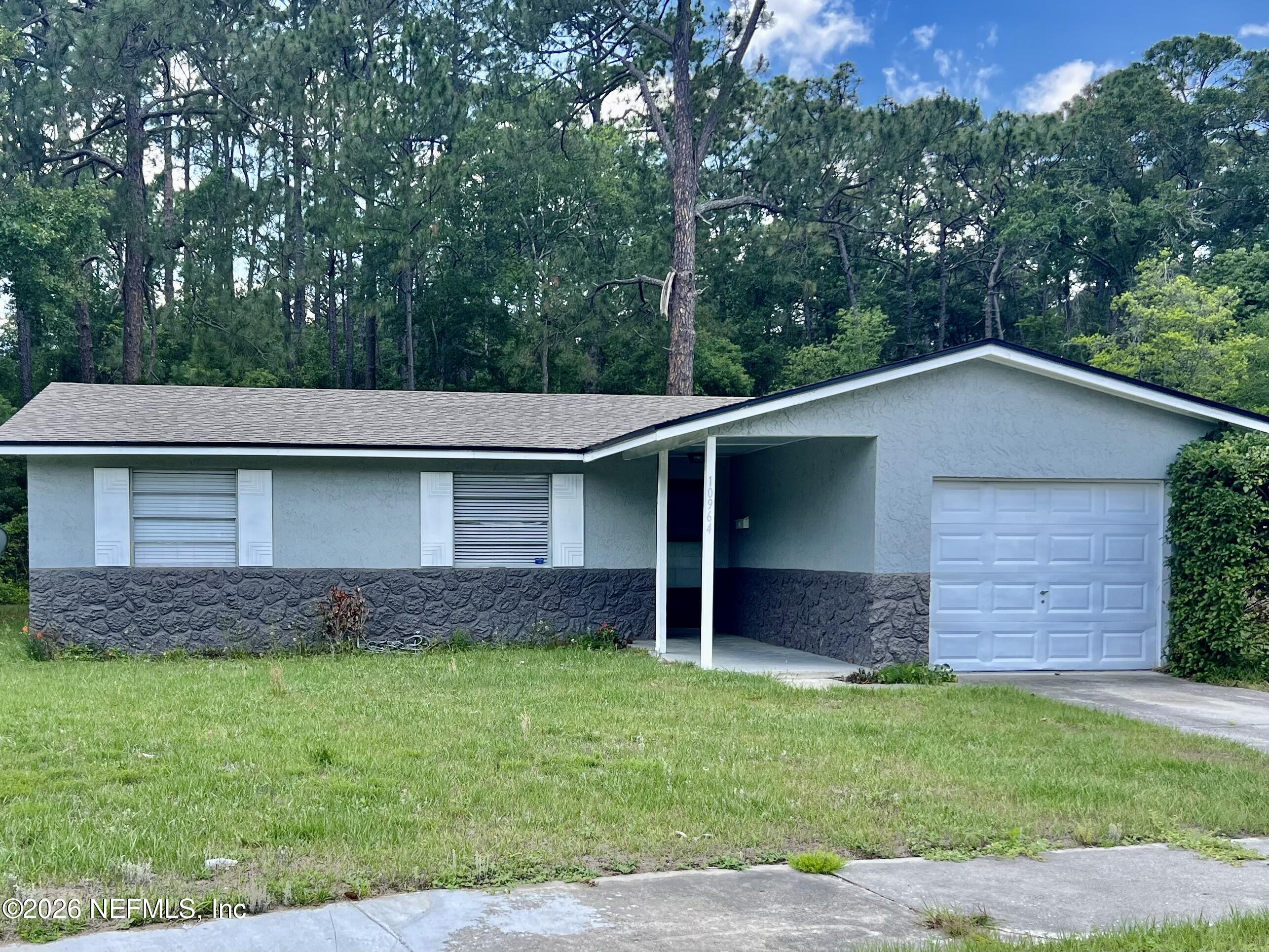 10964 Bacall Road West Jacksonville, FL 32218 - Photo 3 of 19 a view of a house with a yard