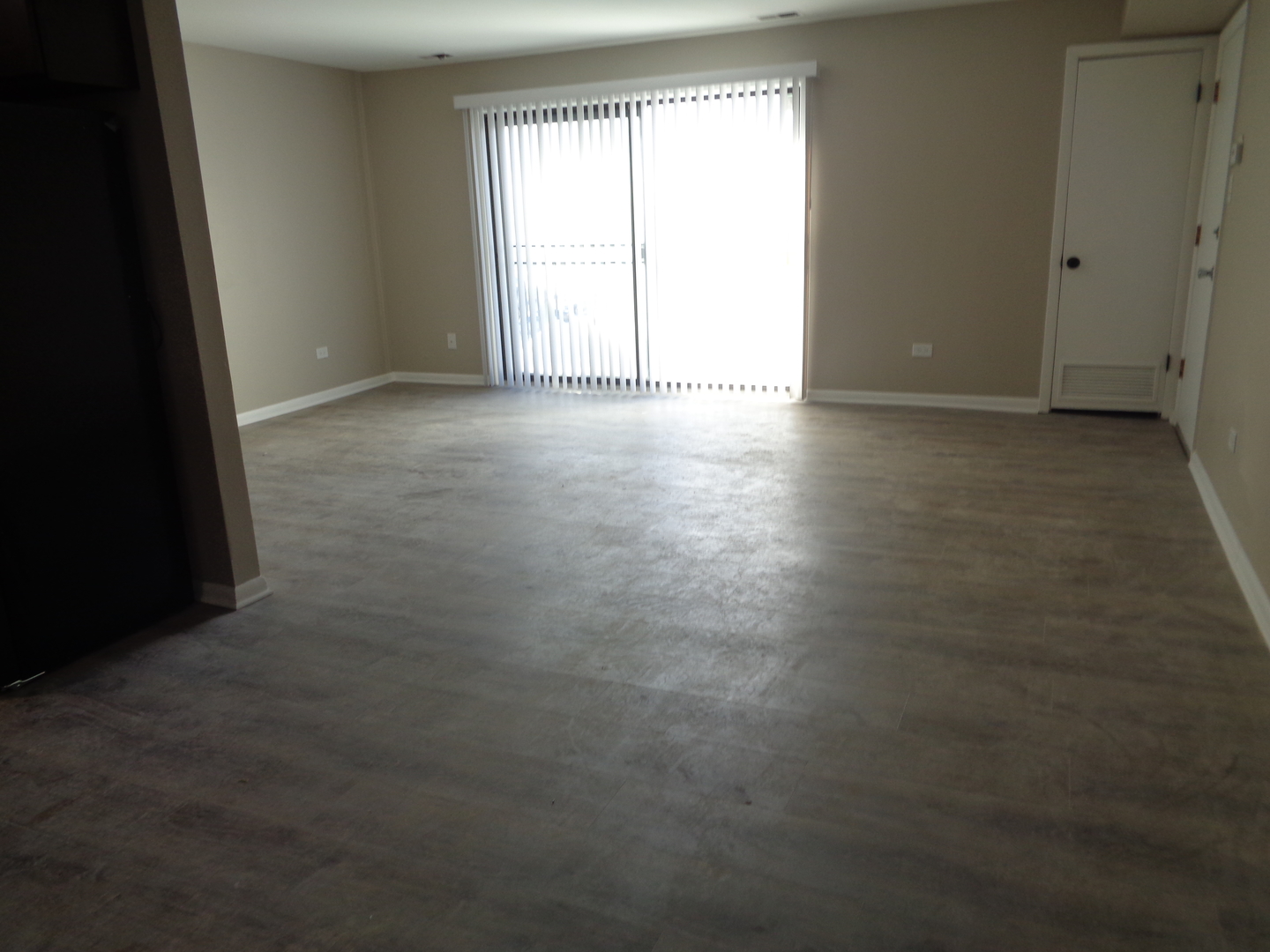 11953 South Lawndale Avenue, Unit 5C2 Alsip, IL 60803 - Photo 3 of 12 an empty room with windows