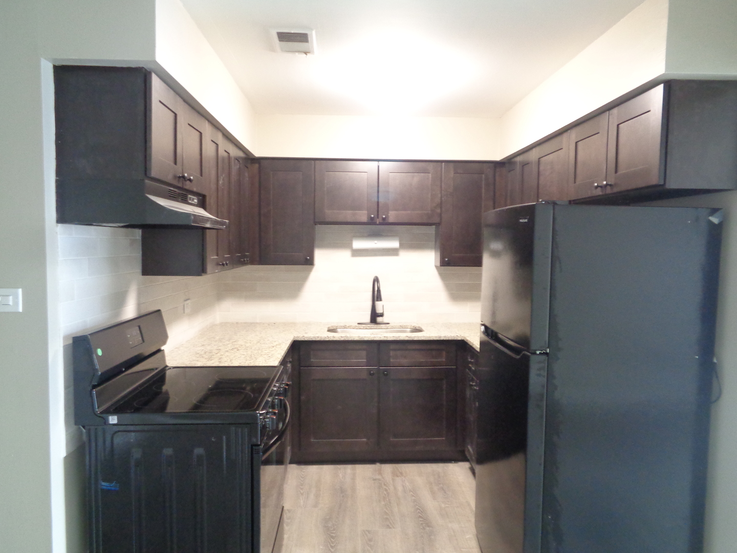 11953 South Lawndale Avenue, Unit 5C2 Alsip, IL 60803 - Photo 9 of 12 a kitchen with stainless steel appliances a refrigerator and a sink