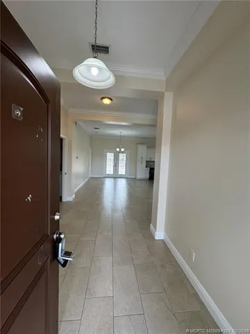 a view of an empty room and a window