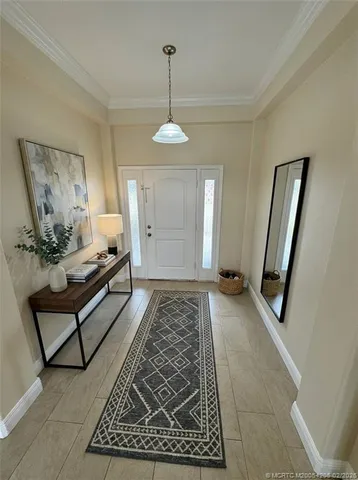 a large kitchen with kitchen island granite countertop a large counter top stainless steel appliances and cabinets