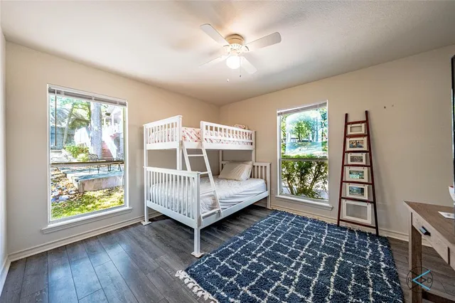 a bedroom with furniture and a window