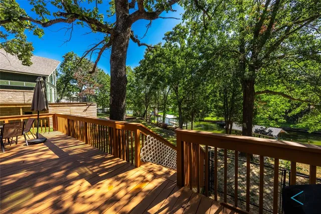 a view of a balcony with wooden floor