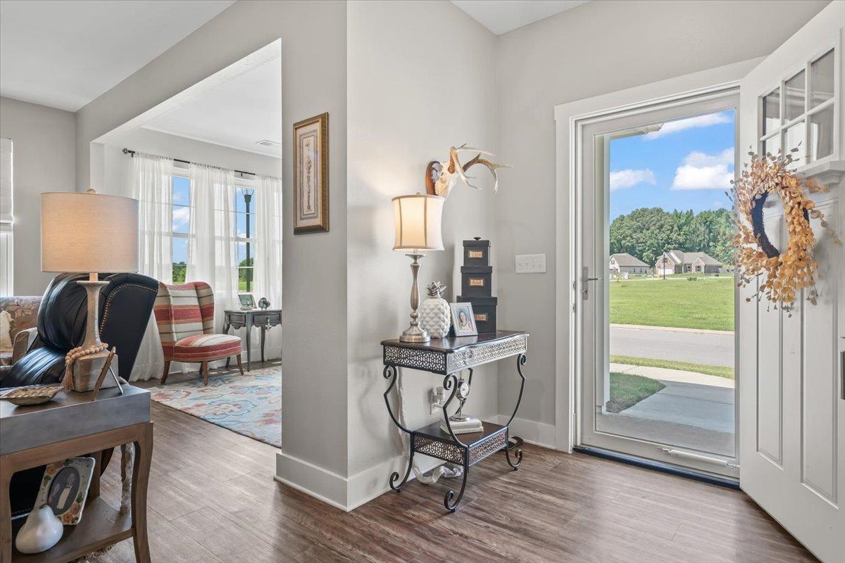 415 Abbey Road, Unit D Munford, TN 38058 - Photo 3 of 35 Entryway featuring wood-finish flooring, crisp white trim, and light gray wall paint