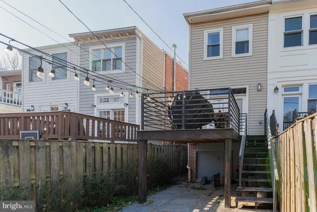 a view of a house with iron stairs