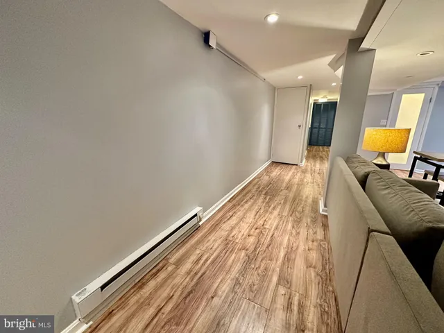 a view of a room with wooden floor and chair