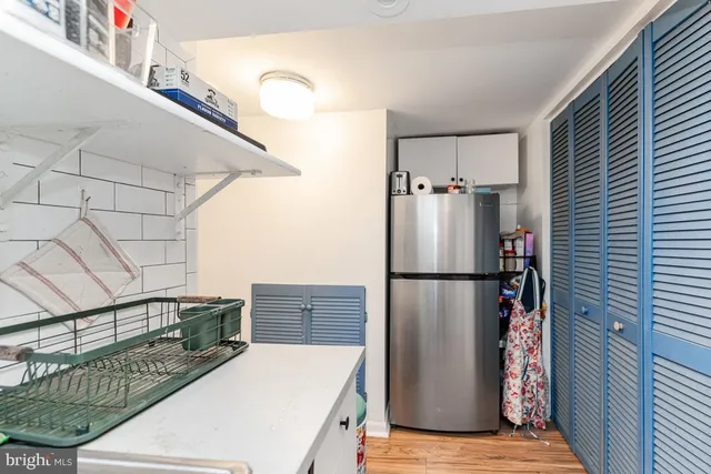 a white refrigerator freezer sitting inside of a kitchen