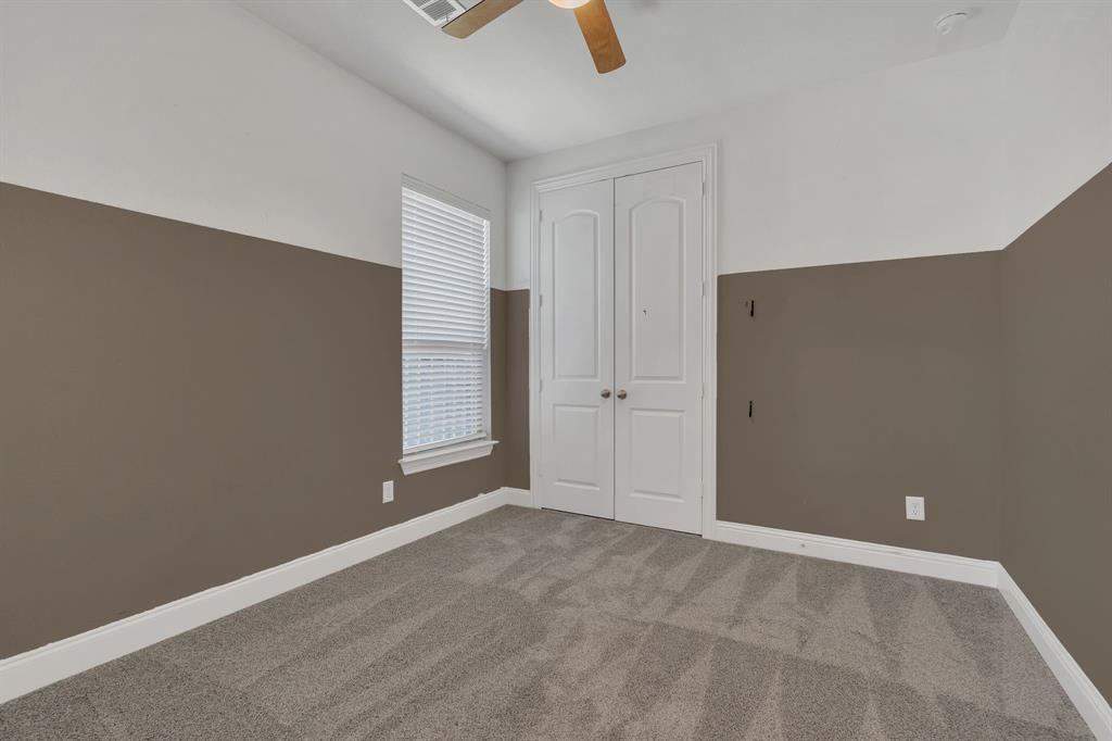 2805 Buckthorn Road Northlake, TX 76226 - Photo 6 of 27 Unfurnished bedroom featuring carpet flooring, a closet, and a ceiling fan