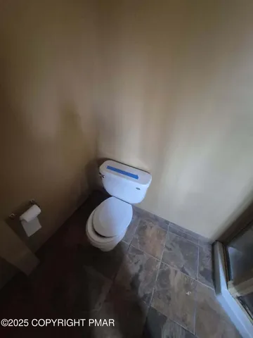 a bathroom with a toilet