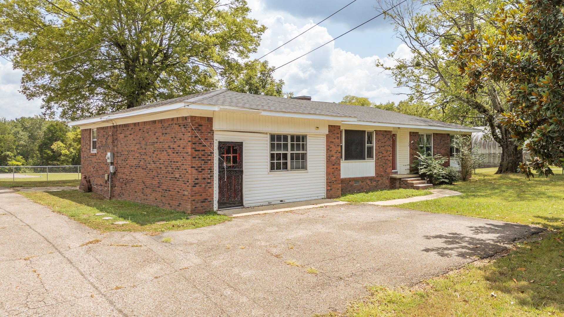 70 South Riverside Drive Savannah, TN 38372 - Photo 19 of 40 a view of a house with backyard and trees