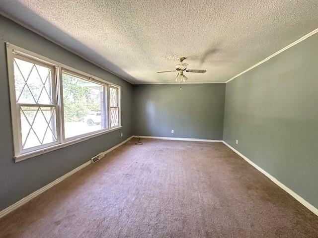 70 South Riverside Drive Savannah, TN 38372 - Photo 22 of 40 en empty room with windows and chandelier fan