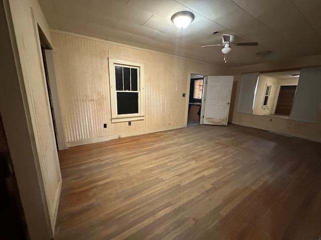 70 South Riverside Drive Savannah, TN 38372 - Photo 34 of 40 an empty room with wooden floor and windows