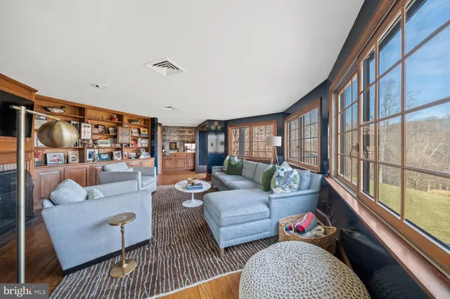 a kitchen with stainless steel appliances a refrigerator a stove and white cabinets