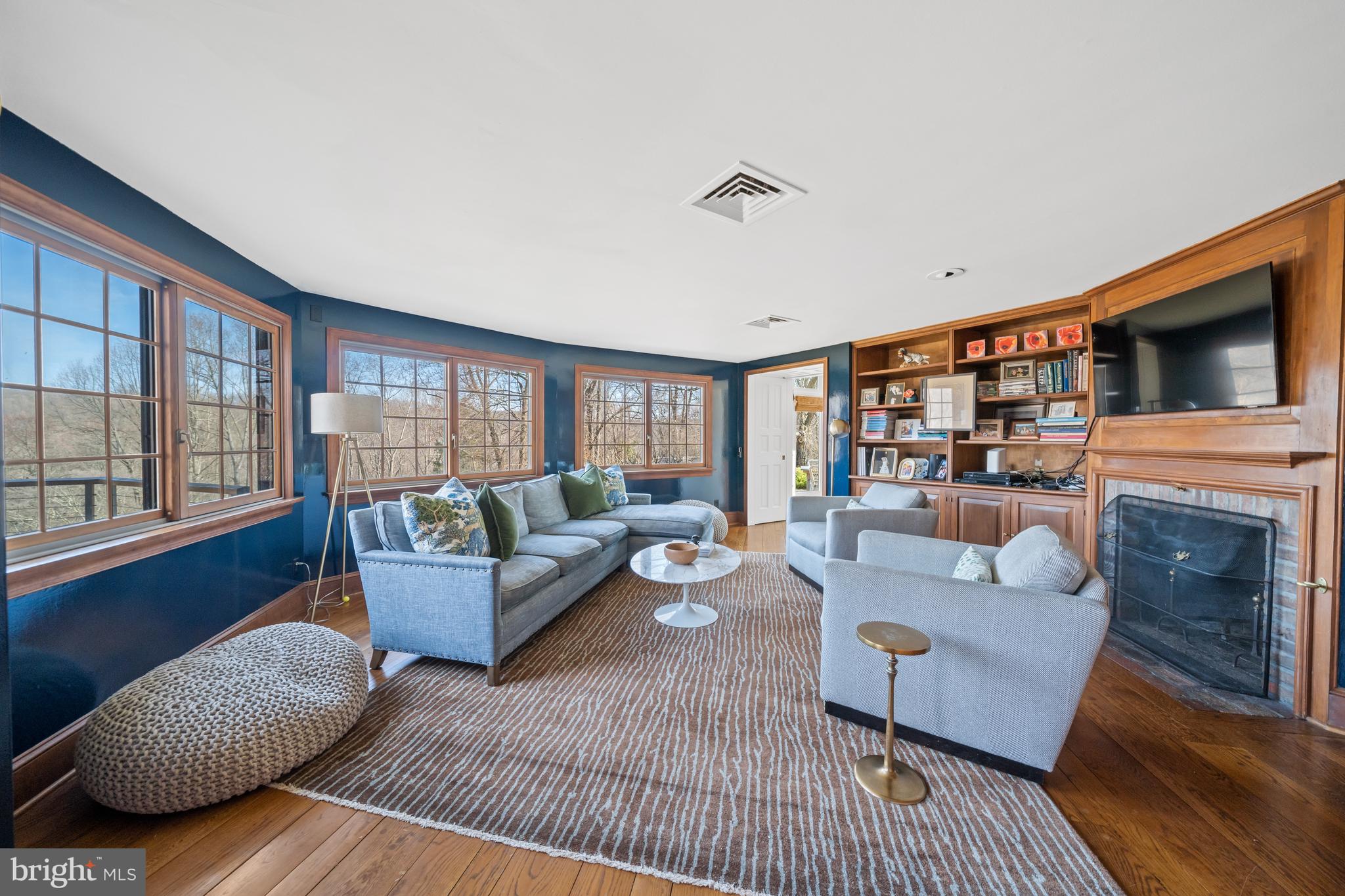 3930 Thompsons Bridge Road Wilmington, DE 19807 - Photo 14 of 69 a living room with fireplace furniture and a flat screen tv