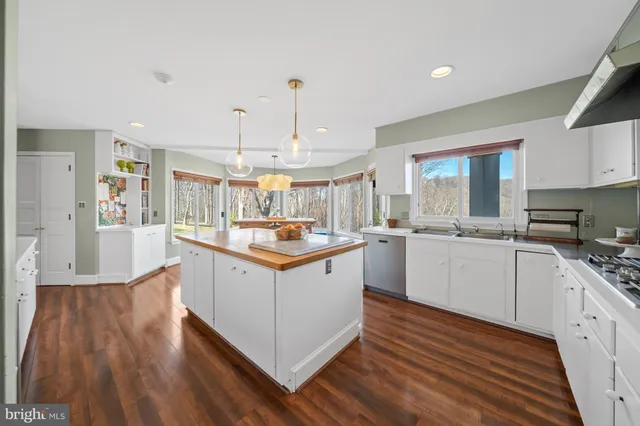a bathroom with a tub shower and closet