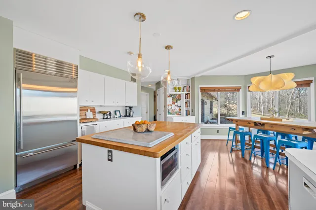 a bathroom with a sink a toilet and shower curtain