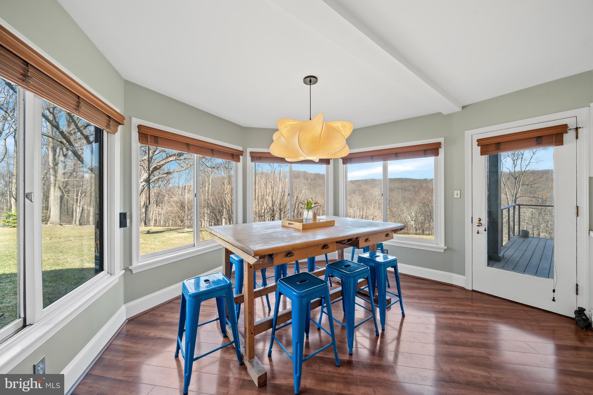 3930 Thompsons Bridge Road Wilmington, DE 19807 - Photo 24 of 69 a dining room with furniture a chandelier and wooden floor