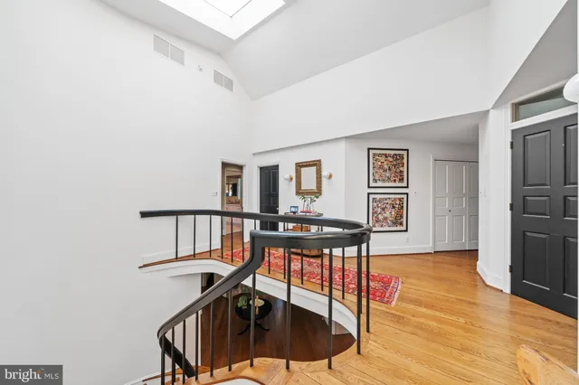 a view of a house with yard and sitting area