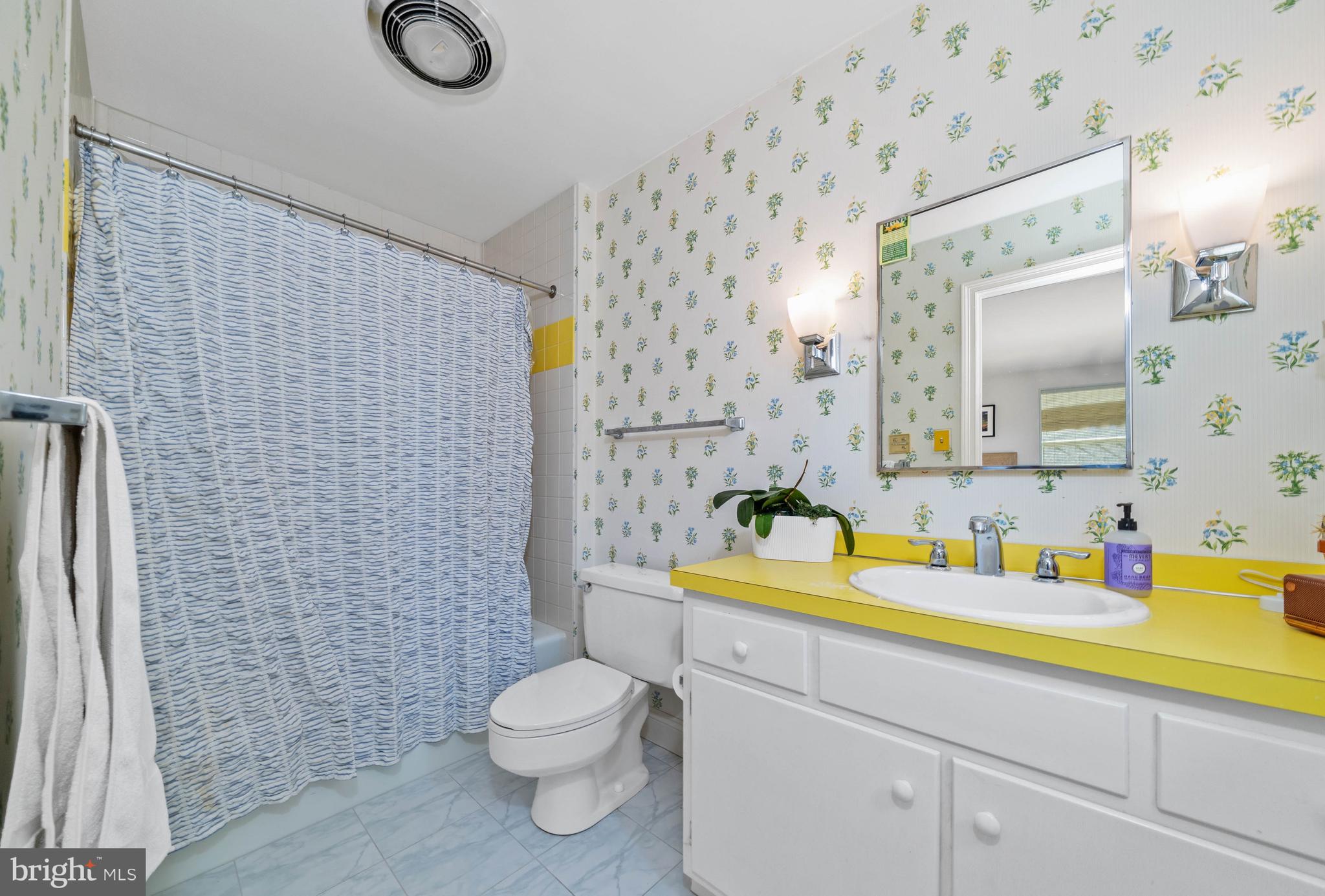 3930 Thompsons Bridge Road Wilmington, DE 19807 - Photo 43 of 69 a bathroom with a sink a toilet and shower curtain