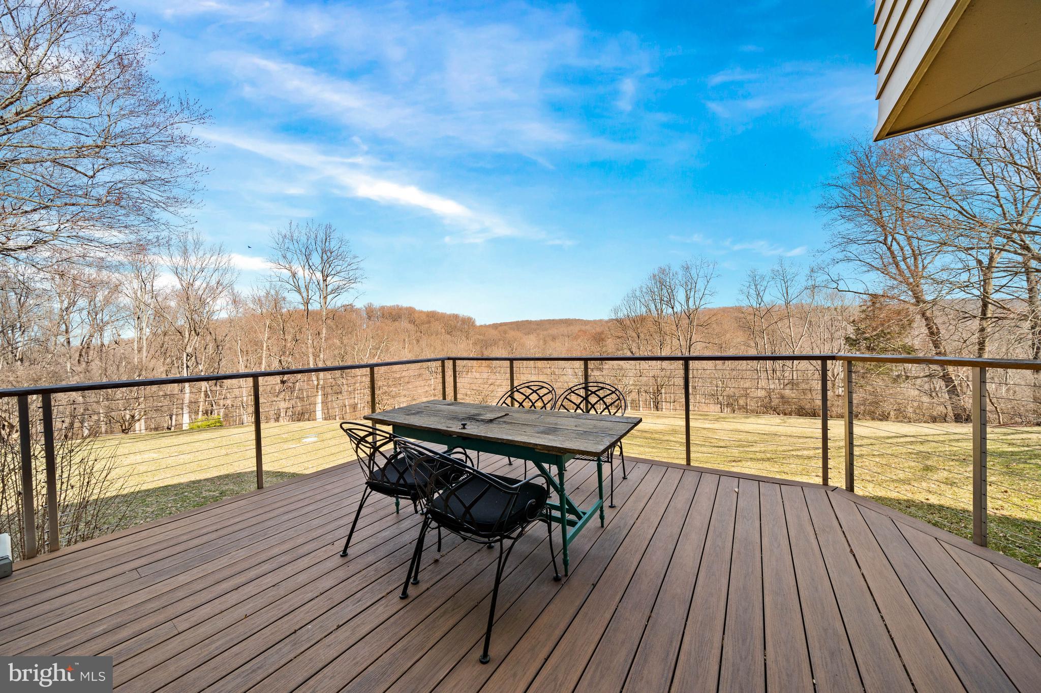 3930 Thompsons Bridge Road Wilmington, DE 19807 - Photo 56 of 69 a view of a balcony with wooden floor and outdoor seating