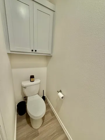 a view of a backyard with a wooden fence