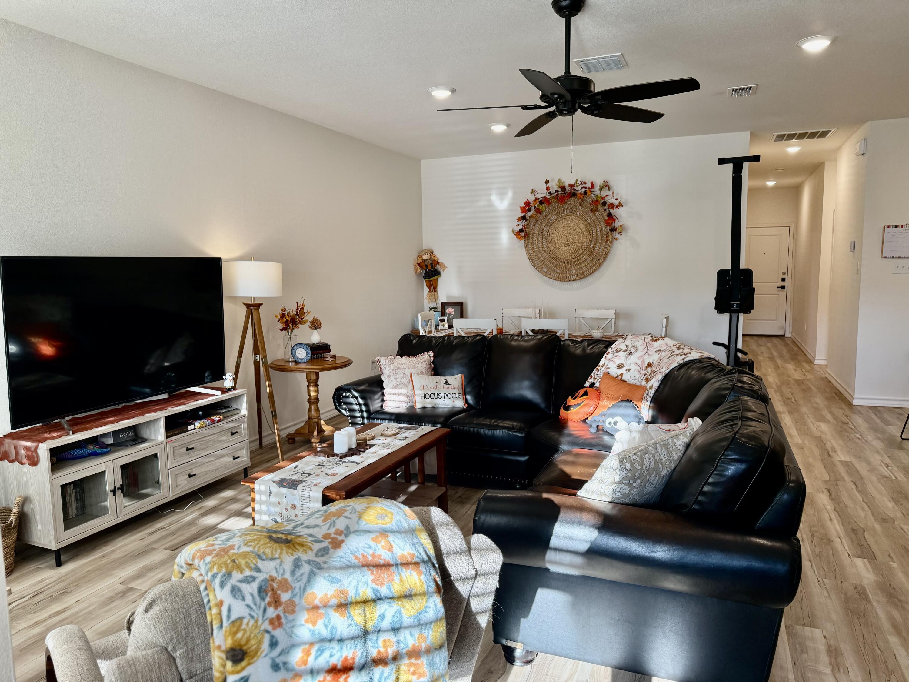 5833 Virginia Avenue Lubbock, TX 79407 - Photo 23 of 33 a living room with furniture and a flat screen tv