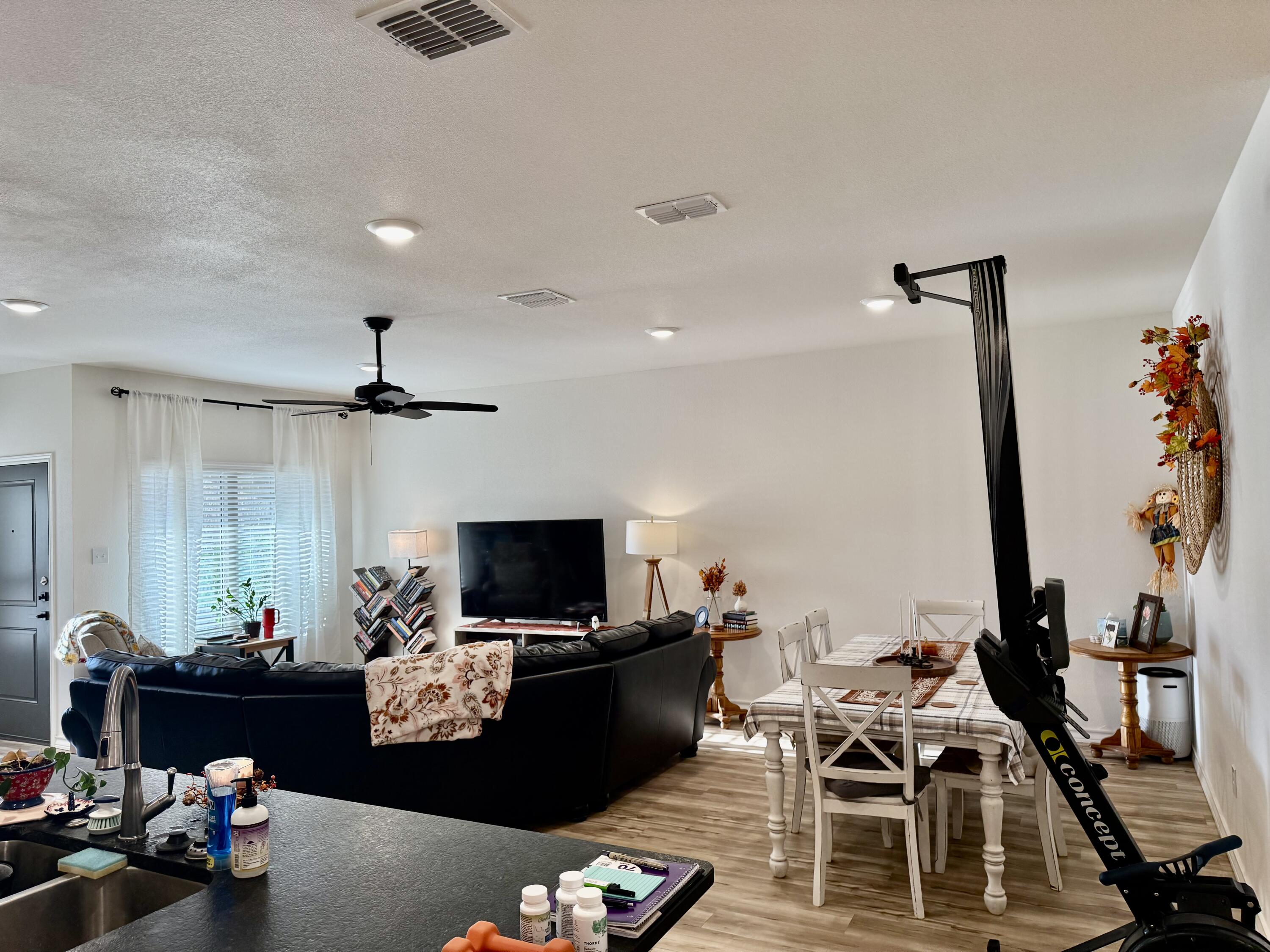 5833 Virginia Avenue Lubbock, TX 79407 - Photo 26 of 33 a living room with furniture and a flat screen tv