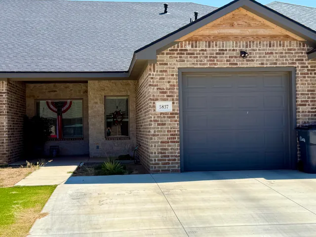 a view of outdoor space and front view of a house