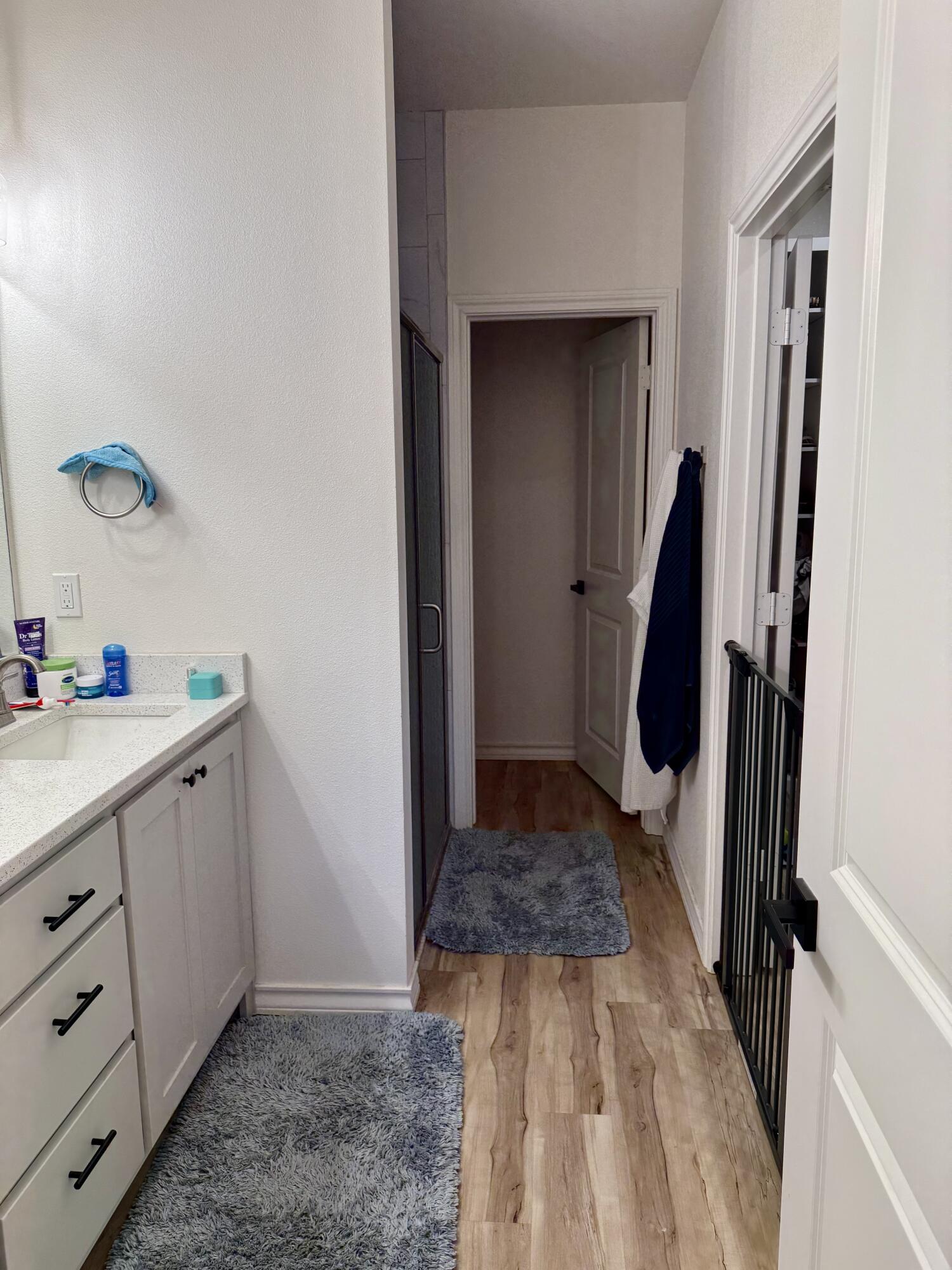 5833 Virginia Avenue Lubbock, TX 79407 - Photo 32 of 33 a bathroom with a sink and a mirror
