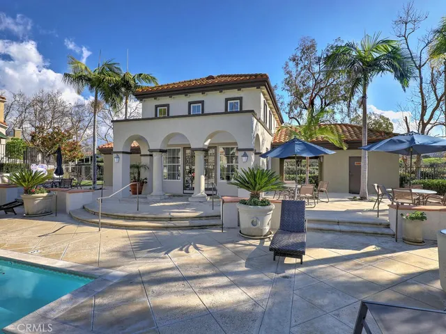 a view of a swimming pool with a lounge chairs