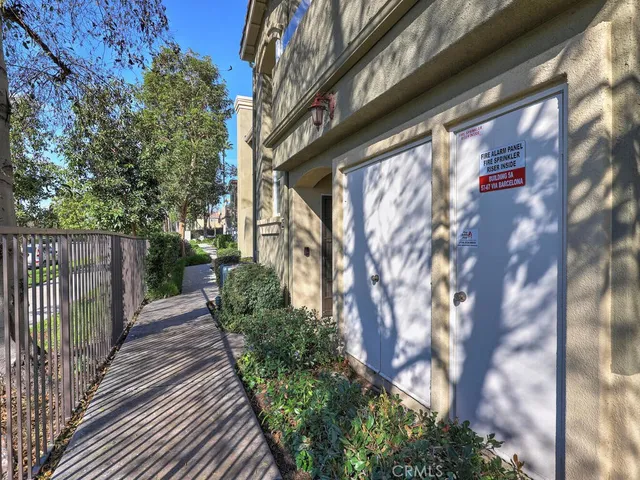 a view of a house with a small yard
