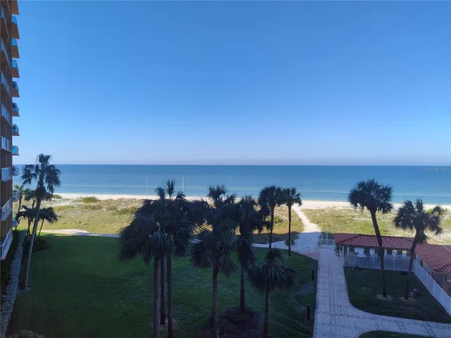 a view of a ocean with outside a house