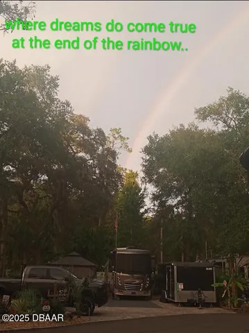 a view of a chair and tables in the backyard