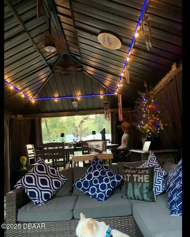 a view of a chair and table in the garden