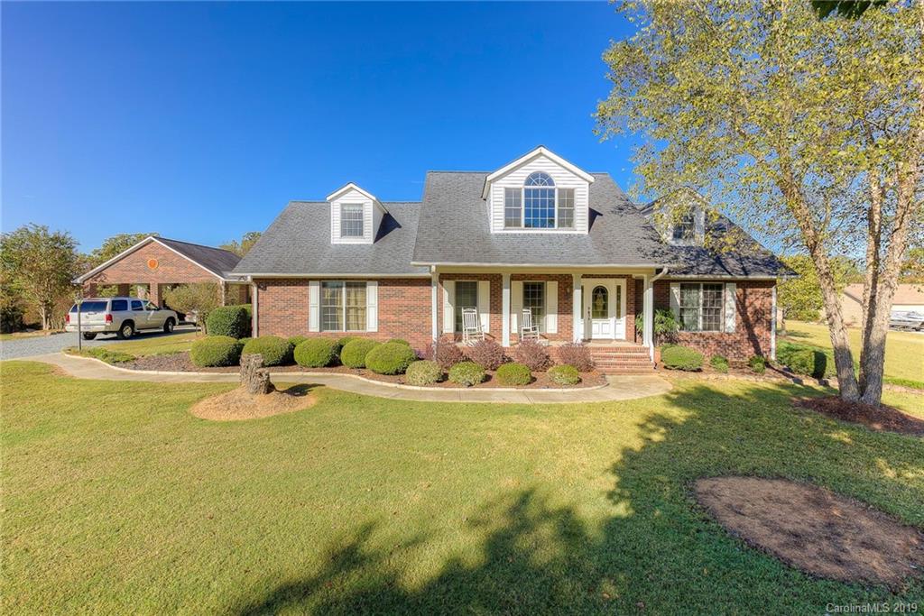 34863 Finger Road Mount Pleasant, NC 28124 - Photo 2 of 32 a front view of a house with swimming pool having outdoor seating
