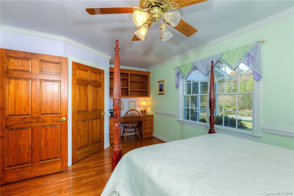 34863 Finger Road Mount Pleasant, NC 28124 - Photo 16 of 32 a bedroom with a bed and wooden floor