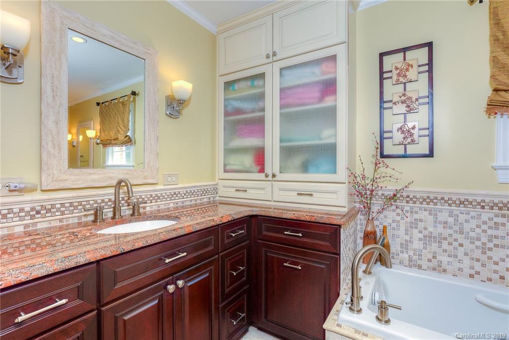 34863 Finger Road Mount Pleasant, NC 28124 - Photo 18 of 32 a bathroom with a sink a vanity and a mirror