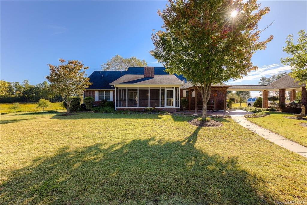 34863 Finger Road Mount Pleasant, NC 28124 - Photo 31 of 32 a view of a house with swimming pool and a yard