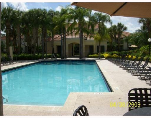 510 South Park Road, Unit 2110 Hollywood, FL 33021 - Photo 3 of 8 a view of swimming pool with lawn chairs and plants