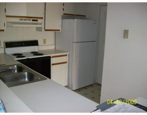 510 South Park Road, Unit 2110 Hollywood, FL 33021 - Photo 4 of 8 a kitchen with a sink and a refrigerator