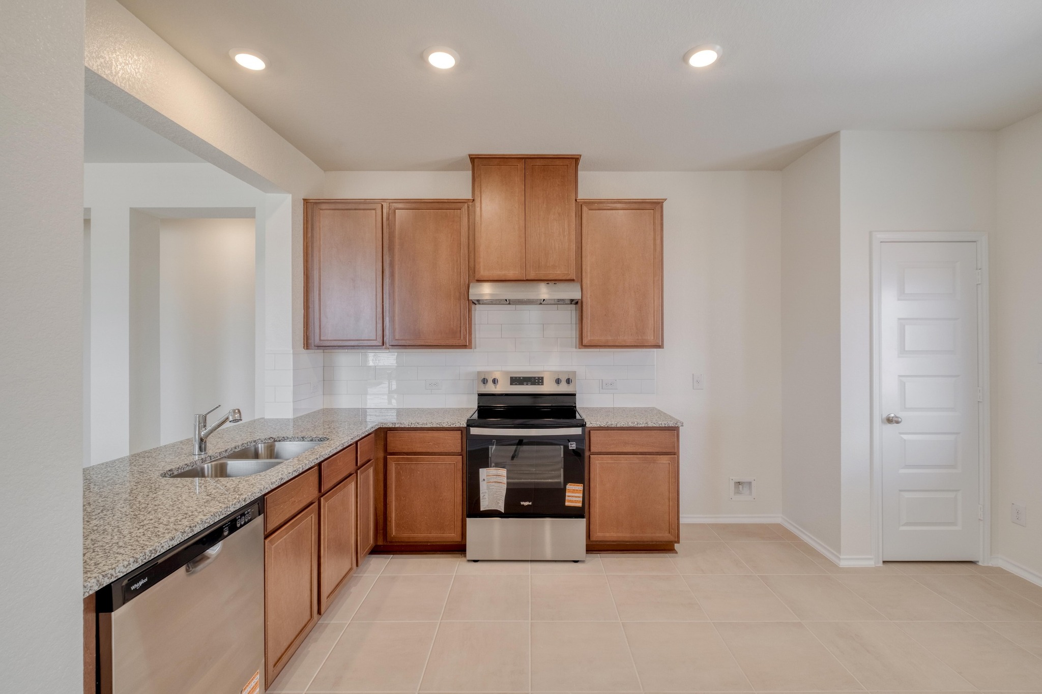 280 Feathers Street Jarrell, TX 76537 - Photo 11 of 28 a kitchen that has a sink and a stove