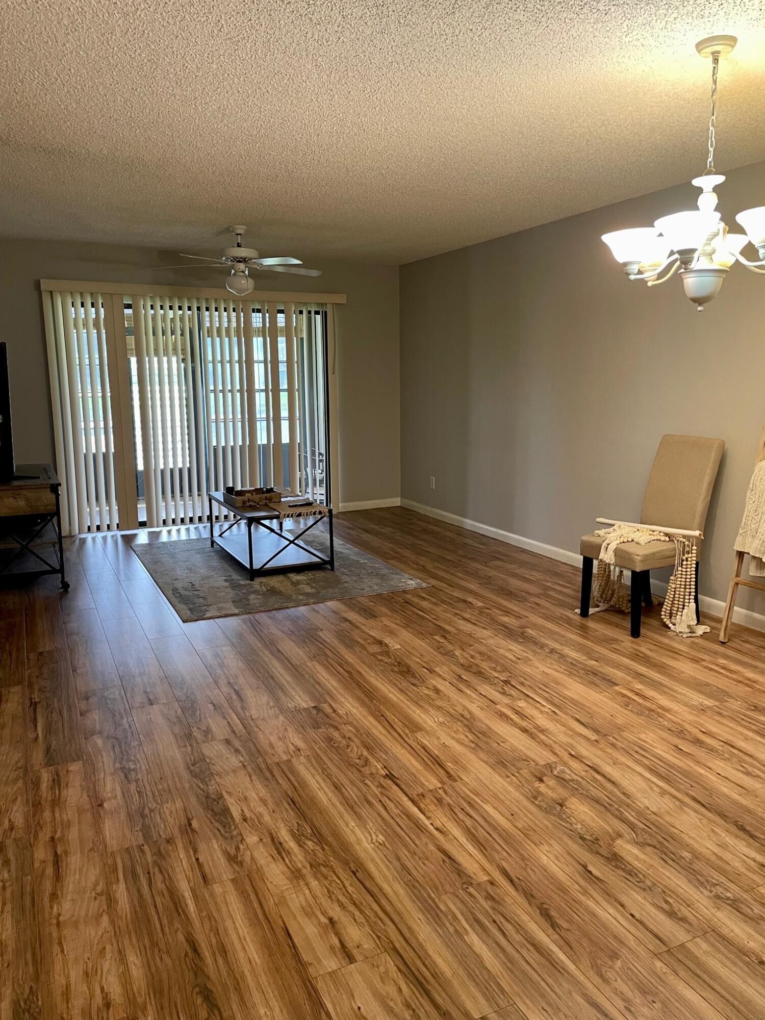 1271 Southeast Parkview Place, Unit H4 Stuart, FL 34994 - Photo 4 of 15 a view of an empty room with a window