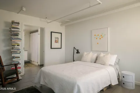 a bedroom with a bed and a closet