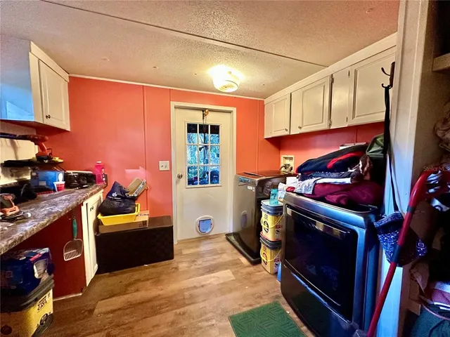 a kitchen with a stove and a refrigerator