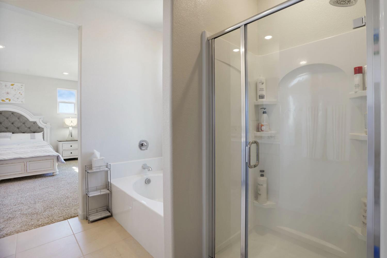 6949 Foraker Drive Stockton, CA 95219 - Photo 29 of 34 a bathroom with a bathtub shower sink and toilet