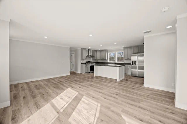a view of kitchen with wooden floor